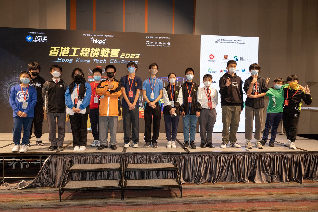 School robotics team taking the stage at the Hong Kong Engineering Challenge 2023